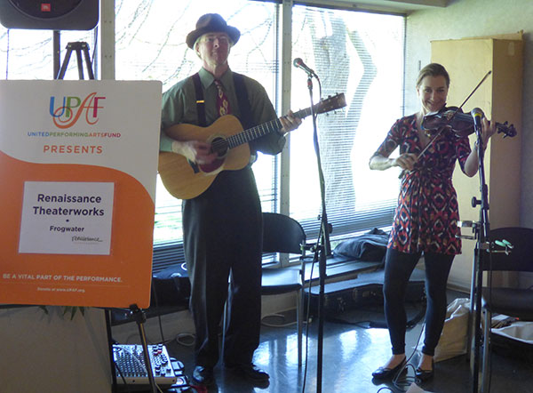 Man with guitar and woman with violin